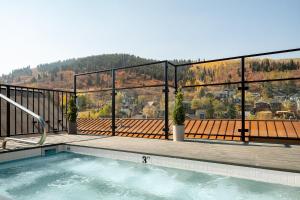 a swimming pool on the balcony of a house at LIFT LODGE 102 condo in Park City