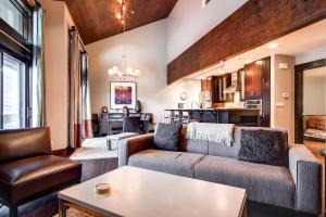 a living room with a couch and a table at LAKESIDE 1629 townhouse in Park City