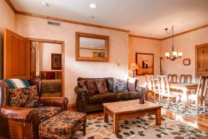 a living room with a couch and a table at LIFT LODGE 203 condo in Park City