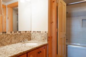 a bathroom with a sink and a mirror at COMSTOCK 205 condo in Park City +18 photos