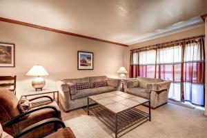 a living room with a couch and a table at PARK STATION 247-1 condo in Park City