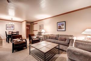 a living room with a couch and chairs and a table at PARK STATION 247-1 condo in Park City +17 photos