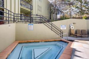 a swimming pool in a building with a staircase at EDELWEISS HAUS 117 condo in Park City
