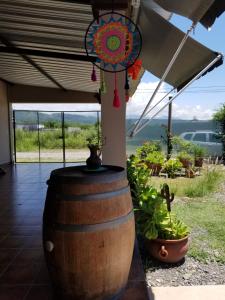 a large barrel with a chandelier on top of it at La Soñadita in Salta