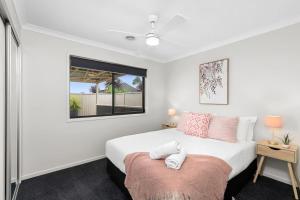 a bedroom with a bed and a window at Chifley Place - Cool Suburban Crib! in Sebastopol
