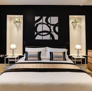 a bedroom with a large white bed with two lamps at InstaLet Apartments I Wigan Central I Free Parking in Wigan