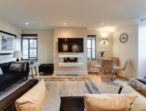 a living room with a couch and a tv at InstaLet Apartments I Wigan Central I Free Parking in Wigan