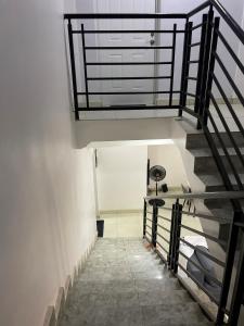 a staircase in a building with a spiral stair case at Entire Serviced Two bedroom duplex Abuja - 24hr WIFI, POWER, OFFICE, FULL KITCHEN in Abuja