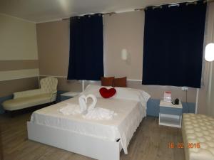 Postel nebo postele na pokoji v ubytování Hotel Moderno