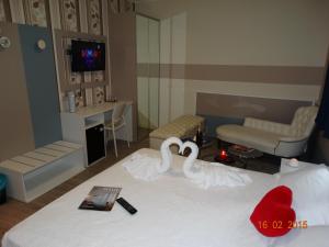Postel nebo postele na pokoji v ubytování Hotel Moderno