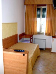 Postel nebo postele na pokoji v ubytování Hotel Fontana