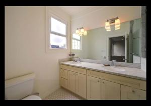 a bathroom with a sink and a toilet and a window at Big Lux Home w/Beaches, Golden Gate Park & Bridge. in San Francisco