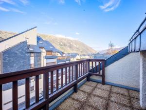 a balcony with a view of the mountains at Appartement 4 pers, St Lary, animaux acceptés - FR-1-296-456 in Saint-Lary-Soulan