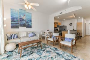 a living room with a couch and a table at Galveston Luxury High Rise Oceanfront in Galveston