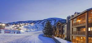 a ski resort with a ski slope and a ski lift at SNOW FLOWER 029 condo in Park City