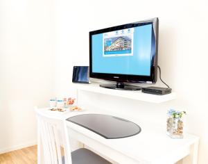En tv och/eller ett underhållningssystem på Attendo Park Hotell