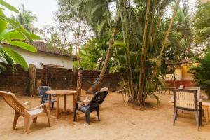 a group of chairs and tables in a yard at SPACELAND Mandrem in Mandrem