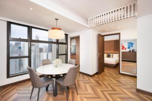 a dining room with a table and chairs at Shama Central in Hong Kong