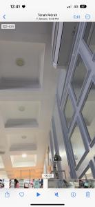a picture of a room with a ceiling with windows at Aisyah homestay islam shj in Tanah Merah
