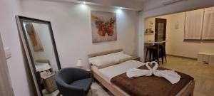 Postel nebo postele na pokoji v ubytování Apartmani Tatić Štinjan