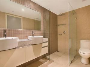 A bathroom at High Above, Pandanas Darwin 21st floor with views