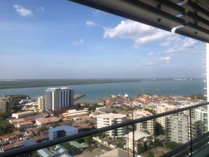 A balcony or terrace at High Above, Pandanas Darwin 21st floor with views