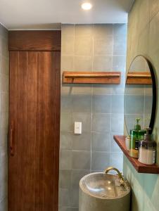 a bathroom with a sink and a mirror at PHAM. Hotel & Views in Hai Phong +30 photos