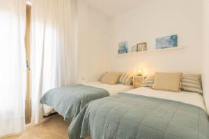Posteľ alebo postele v izbe v ubytovaní Osario Suite Centro Cordoba