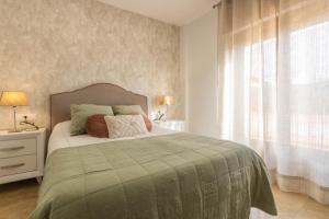 Posteľ alebo postele v izbe v ubytovaní Osario Suite Centro Cordoba