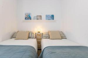 Posteľ alebo postele v izbe v ubytovaní Osario Suite Centro Cordoba