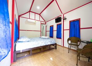 Un pat sau paturi într-o cameră la Baan Pak Wangthong