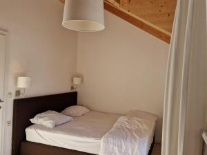 A bed or beds in a room at Chalet in Kötschach by Ski Slopes