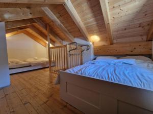 A bed or beds in a room at Chalet in Kötschach by Ski Slopes