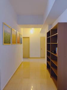 a room with a hallway with shelves and a room with a hallway at Fahrenheit 88 Pavillion By Abby comfy stay in Kuala Lumpur