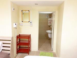 a bathroom with a toilet and a sink and a mirror at Ban Lake View in Pak Chong