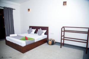 Letto o letti in una camera di Sunliya Resort