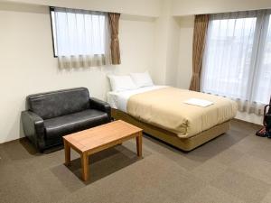 Voodi või voodid majutusasutuse HOTEL LiVEMAX Kyoto Nijojonishi toas