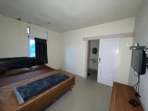 Tempat tidur dalam kamar di Bromo Semesta Guesthouse