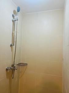a shower stall in a bathroom with a shower at 2305 Azure North Residence by Cozy Lodgings in San Fernando
