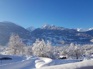 a snow covered valley with mountains in the background at Hotel Montjola Nova in Schruns-Tschagguns