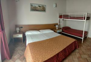 Postel nebo postele na pokoji v ubytování Hotel Agli Ulivi