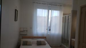 Posteľ alebo postele v izbe v ubytovaní Studio neuf atypique centre ville Palavas vue mer
