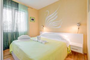 Postel nebo postele na pokoji v ubytování Apartman Petra 5 + 30 fotografií