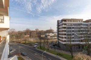 a view of a building and a road with cars at GA Luxury Apartments G244 in Krakow