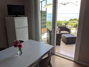 a room with a table and a view of the ocean at Villa Molino in Moniga