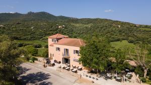 an aerial view of a house with a tree at Hôtel - Restaurant U Santu Petru in Saint-Florent