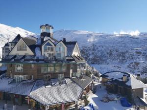 an aerial view of a house on top of a mountain at Plaza Andalucía Edificio Dornajo 2-4 pax in Monachil