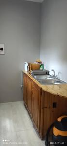 a kitchen with a sink and a counter top at Immaculate 2-Bed Garden Cottage in Beaufort West in Beaufort West