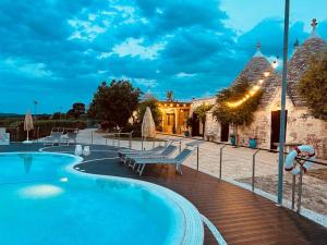 The swimming pool at or close to Trulli Ericla Luxury