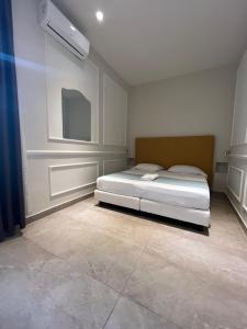 Kama o mga kama sa kuwarto sa Napolit'amo Hotel Principe